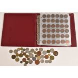 An amateur coin collection contained in an album, comprising UK and overseas examples, Queen