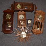Seth Thomas starburst 1950/60s wall clock together with four c1910 wall clocks and a Temco