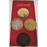 An uncased set of three Feofee of Tetbury millennium medallions, unnumbered, one gilt, one white