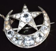 Victorian silver brooch set with old cut paste in the form of a crescent and star