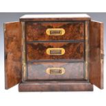 Victorian burr walnut collector's cabinet, the doors locked by Brahmah lock, opening to reveal the