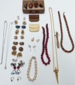 A collection of jewellery including a silver pendant set with copal amber, silver ring set with