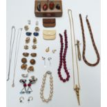 A collection of jewellery including a silver pendant set with copal amber, silver ring set with