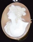 A yellow metal brooch set with a cameo of a young woman, 3.4 x 4.4cm