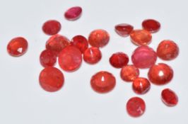 A collection of loose round cut padparadscha sapphires