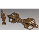 Tibetan brass phurba and a brass model of a deity, largest 24cm