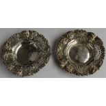 Victorian pair of hallmarked silver bon bon dishes with pierced and embossed decoration, Chester