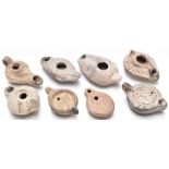 Eight Roman / Roman style oil lamps, some with figural decoration, length of longest 11cm