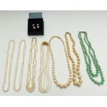A double strand jade necklace with silver clasp, three pearl necklaces, pearl earrings etc