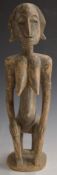 African tribal Bamana carved fertility / maternity figure resting on a stool, H49cm