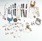 A collection of costume jewellery, coins and watches, including silver bracelet, silver necklace,