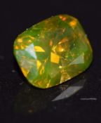 A loose orange/ brown diamond measuring approximately 0.96cts