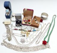 A collection of costume jewellery including necklaces, diamanté, white metal bangle with dichroic