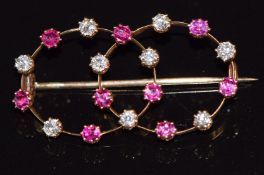 A c1920 gold brooch set with diamonds and rubies, 4g