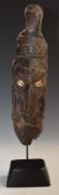 Papua New Guinea Sepik River tribal mask with cowrie shell eyes, on bespoke stand, probably 19thC or