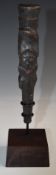 Papua New Guinea Sepik River pestle with carved lizard decoration, on bespoke stand, H18cm