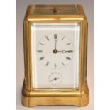 Late 19th/ early 20thC brass carriage clock with repeater and alarm features, white enamel Roman