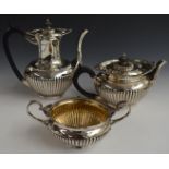 Walker & Hall George V hallmarked silver three piece tea set with reeded lower bodies, Sheffield