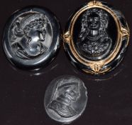 Two carved jet cameo brooches and a French jet cameo
