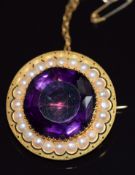 Edwardian circular brooch set with a large amethyst within a border of split pearls, 14g