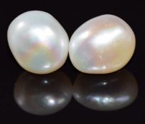 A pair of 9ct gold earrings set with a pearl to each