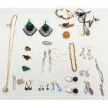 A collection of costume jewellery including a silver brooch set with malachite, silver earrings, etc