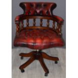 Oxblood red leather upholstered captain's or office chair