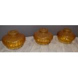 Set of three amber glass light shades, H25, diameter 36cm