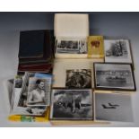 A large collection of c1950s photographs, loose and in albums, including glamour, vintage