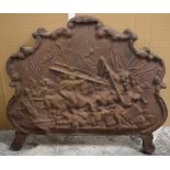 Antique cast iron fireback with relief decoration of mounted riders in a battle scene, ex Fladbury