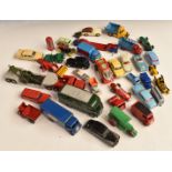 Thirty-eight Corgi, Dinky, Matchbox and similar diecast model vehicles and accessories including