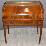 Victorian inlaid mahogany roll top desk with fitted interior and gallery top raised on tapering