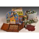 A collection of marbles, puzzles and table top games including Blow Football, Top Trumps and Nim.