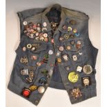 A collection of c1980's Motorhead and other heavy metal related badges, on a denim waistcoat with
