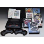 Sega Mega Drive II games console with two controllers and nine games including Echo The Dolphin, NBA