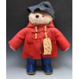Gabrielle Designs Paddington Bear with red jacket, navy hat, blue Wellington boots and label '