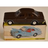 Dinky Toys diecast model 168 Ford Escort with brown body, plated bumpers and trim, 168, in