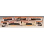 Eleven Fleishmann and Arnold N gauge model railway locomotives and coaches, eight in original boxes.