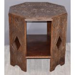 Carved octagonal hardwood table with tribal scenes to top, W63cm, H62cm