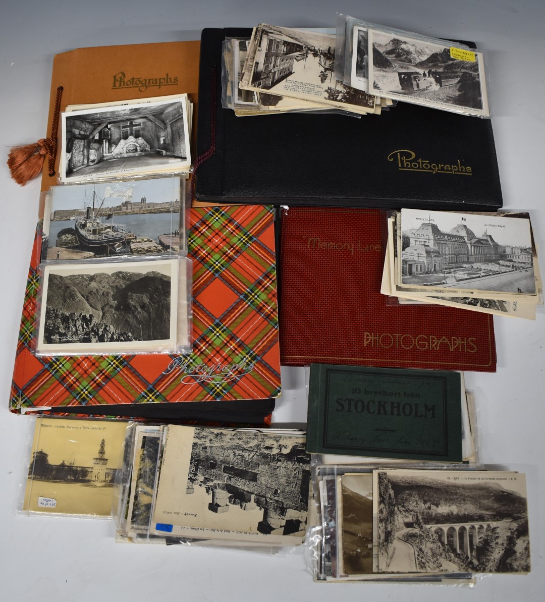 Four albums and approximately 250 loose foreign travel interest photographs and postcards to include