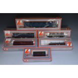 Six Lima 00 gauge model railway locomotives, wagons and vans, all in original boxes.