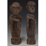 A pair of carved African tribal figures, H35cm