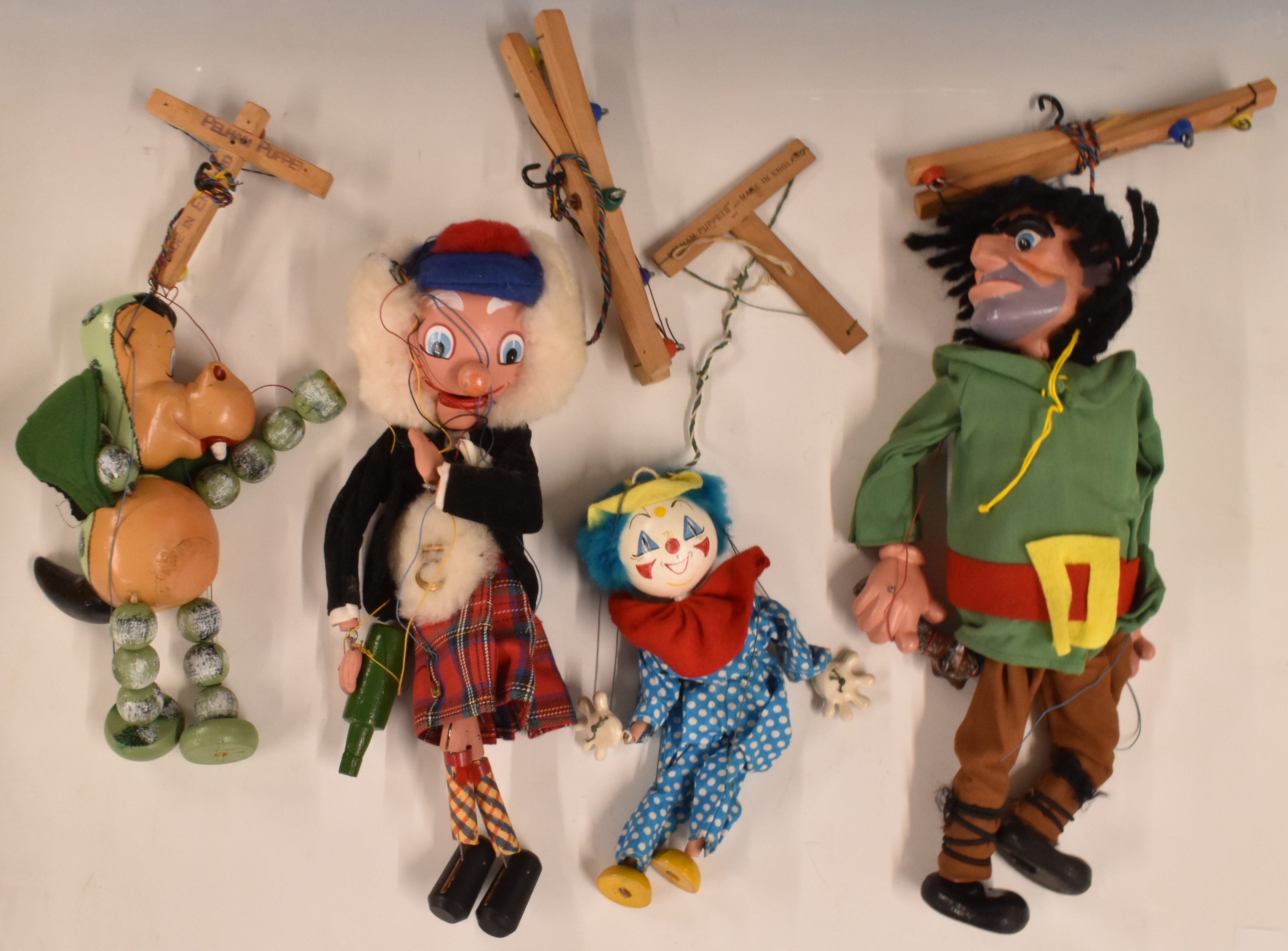 Four Pelham puppets comprising Macboozle, Giant, Baby Dragon and Clown. Some boxed or partially