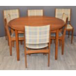 Danish retro teak circular extendable table and six upholstered chairs, diameter 129cm,