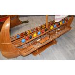 A scratch build model of a Phoenician Galley, early Bireme, with singe mast sail, oars and