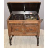 Gilbert c1930s wind up parlour gramophone in carved oak case, standing on barley twist legs, W83 x