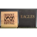 CDs - Creedence Clearwater Revival six CD box set, and Eagles seven CD box set, both appear EX