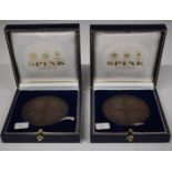 Two Armes of Tetbury bronze Millennium medallion coins, in Spink cases