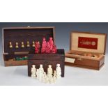 A weighted boxwood chess set with ivory chess pieces, in a wooden cigar box, height of king 9.8cm