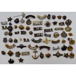 Collection of military badges and shoulder titles including Royal Navy, Royal British Legion,